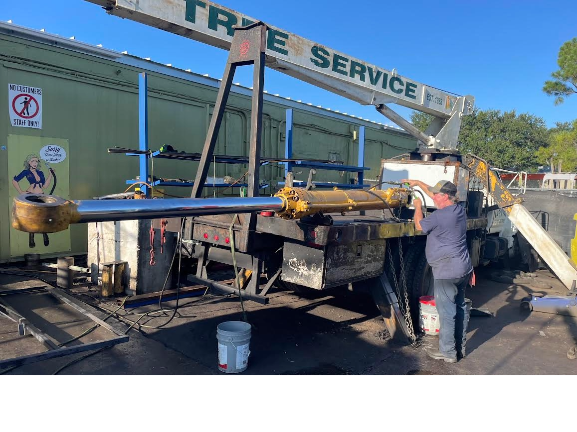 Large rebuilt hydraulic ram loaded on a truck
